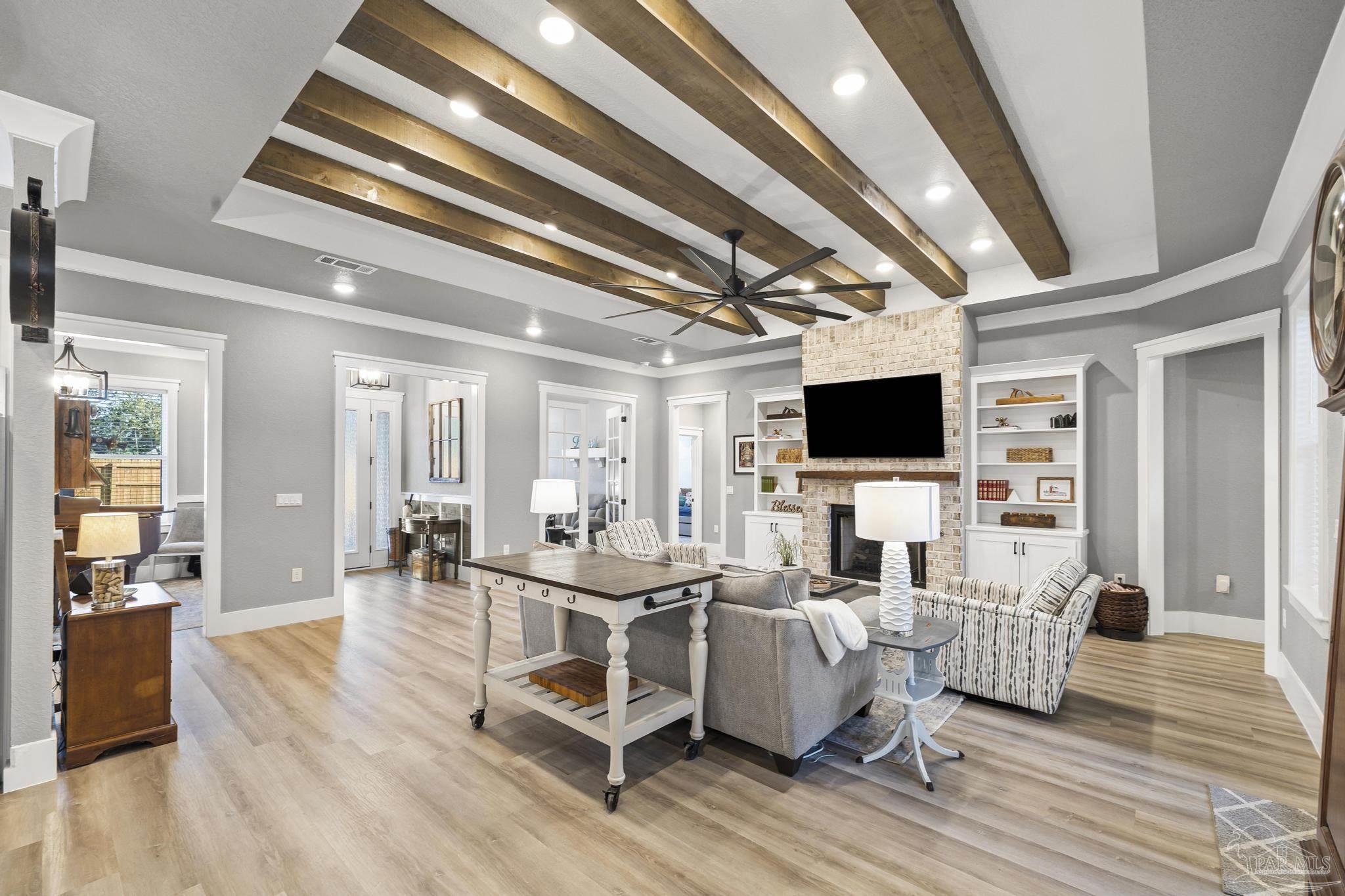 8415 Beulah Road Pensacola, FL 32526 - Photo 5 of 59 a living room with furniture wooden floor and a flat screen tv