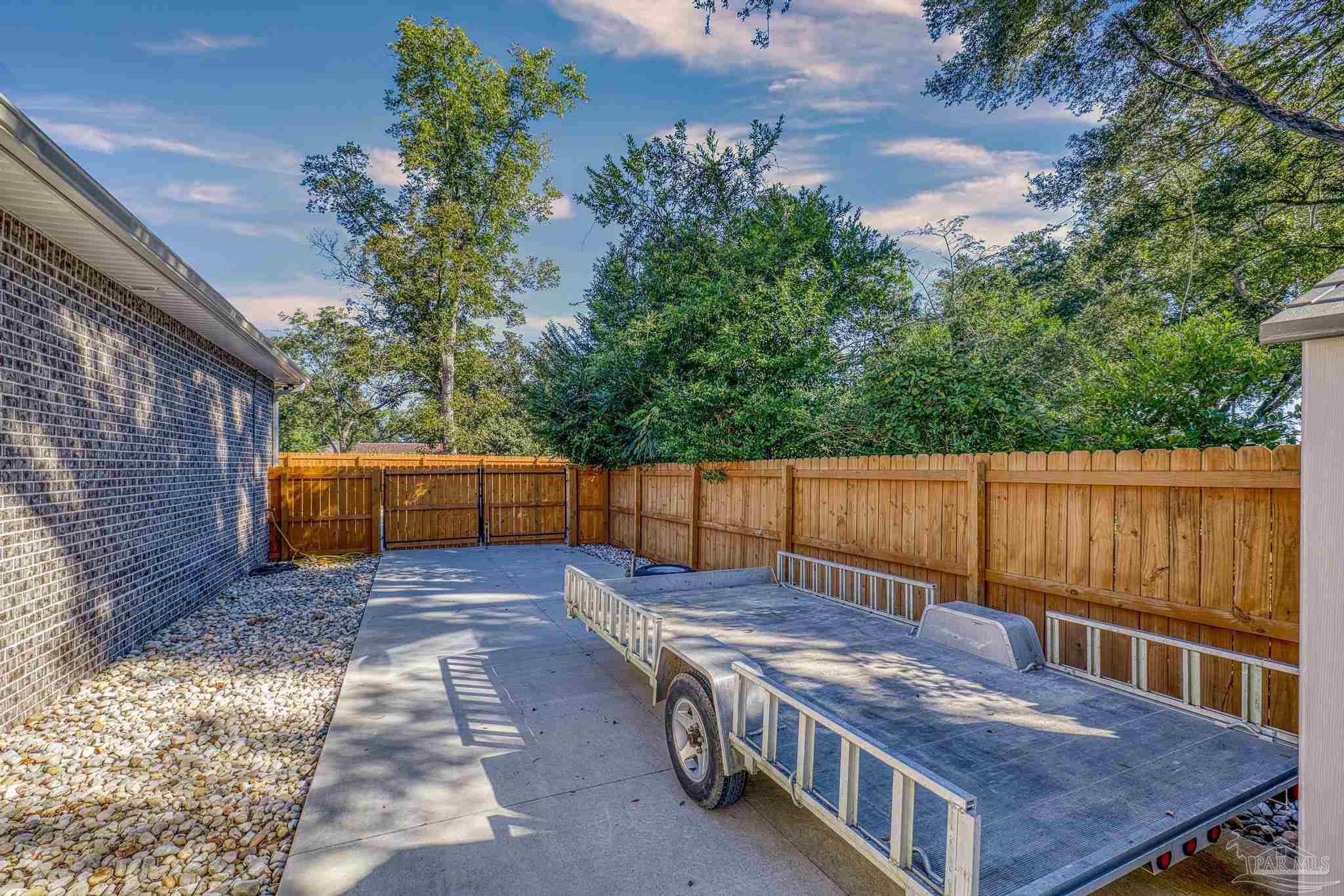 8415 Beulah Road Pensacola, FL 32526 - Photo 51 of 59 a view of a backyard with a deck