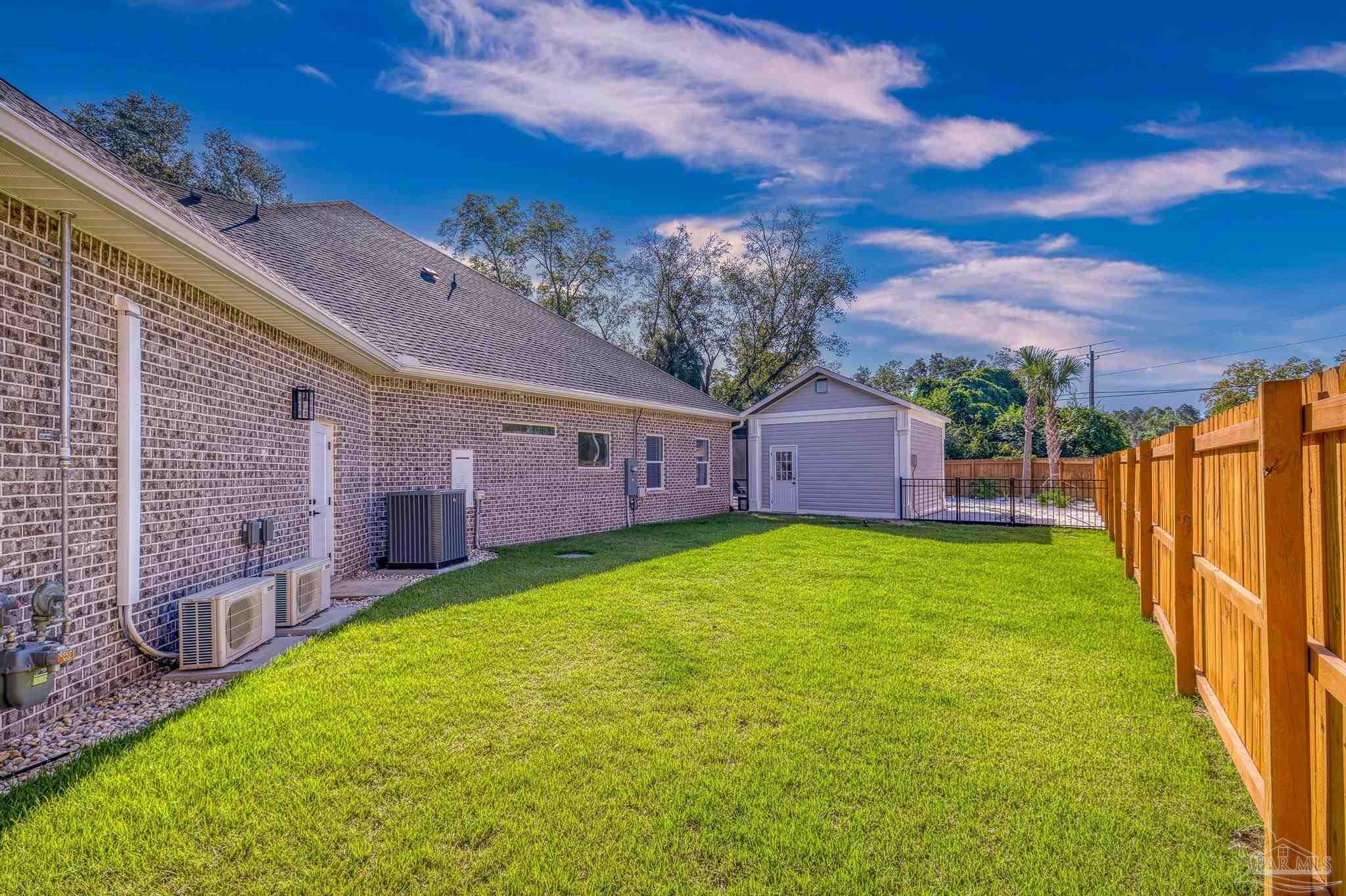 8415 Beulah Road Pensacola, FL 32526 - Photo 54 of 59 a view of a house with a backyard