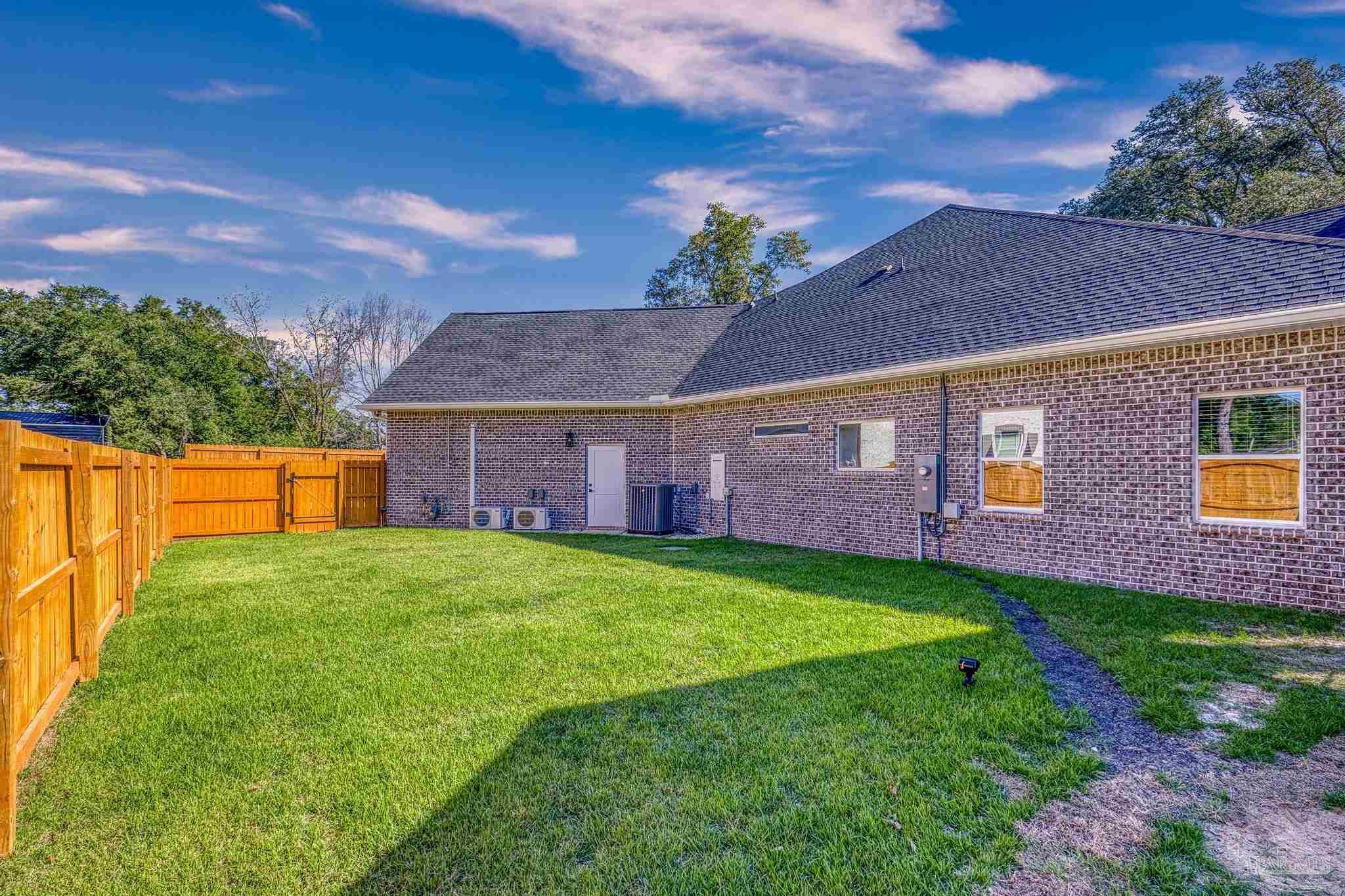 8415 Beulah Road Pensacola, FL 32526 - Photo 55 of 59 a view of a yard in front of a house with large trees