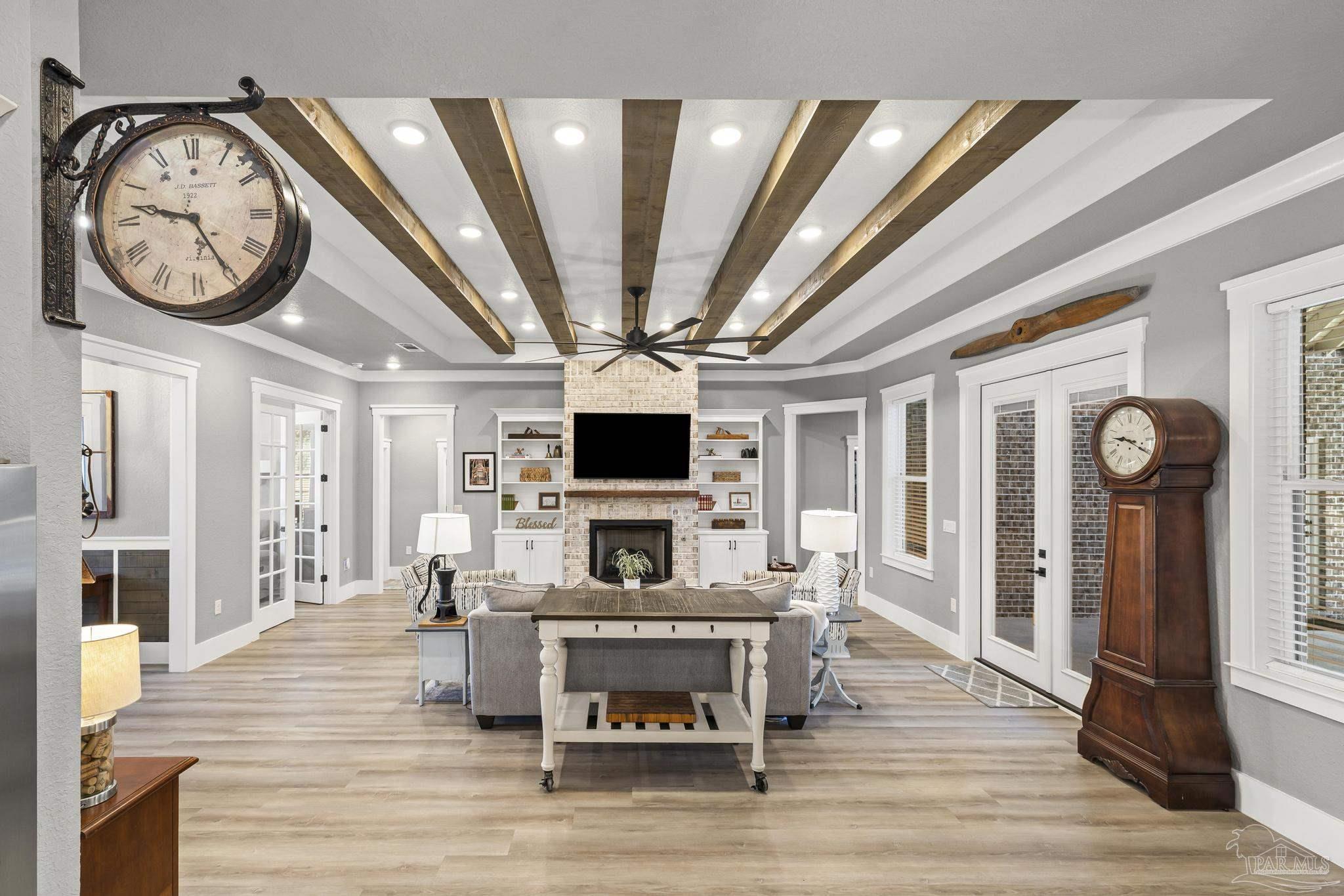 8415 Beulah Road Pensacola, FL 32526 - Photo 6 of 59 a living room with furniture a flat screen tv and a fireplace