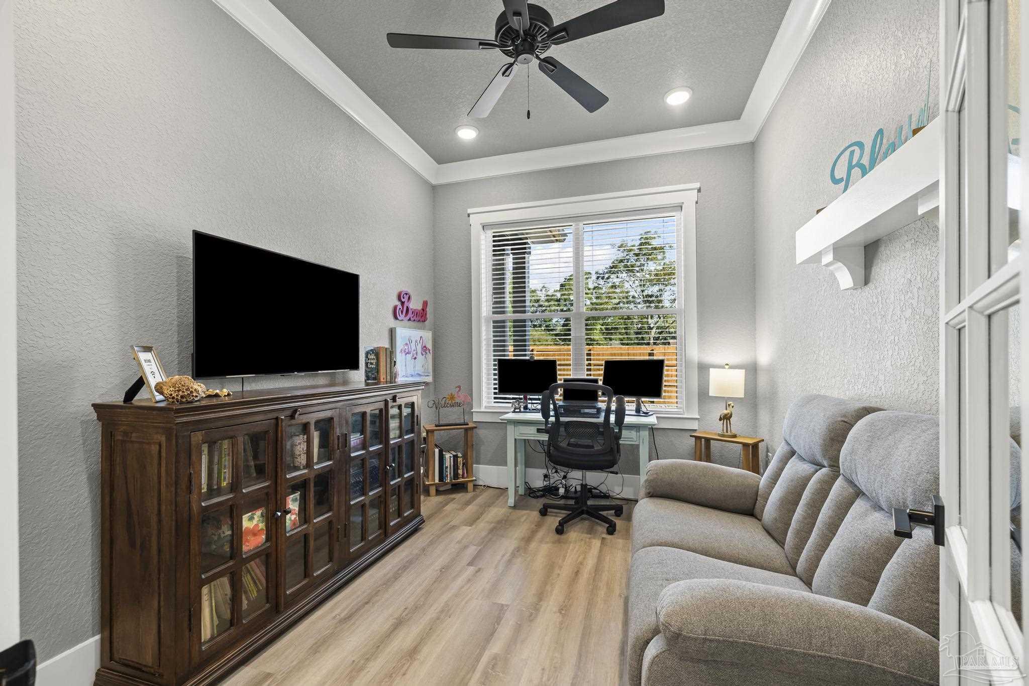 8415 Beulah Road Pensacola, FL 32526 - Photo 9 of 59 a living room with furniture and a flat screen tv