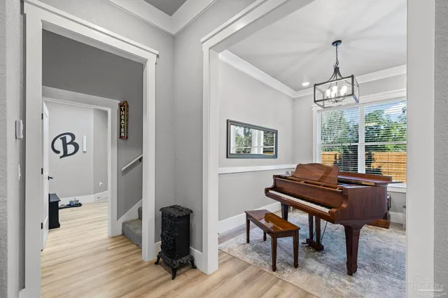 a kitchen with stainless steel appliances granite countertop a refrigerator a oven a stove and a sink with dishwasher