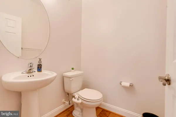 a kitchen with granite countertop a stove a sink dishwasher and a refrigerator