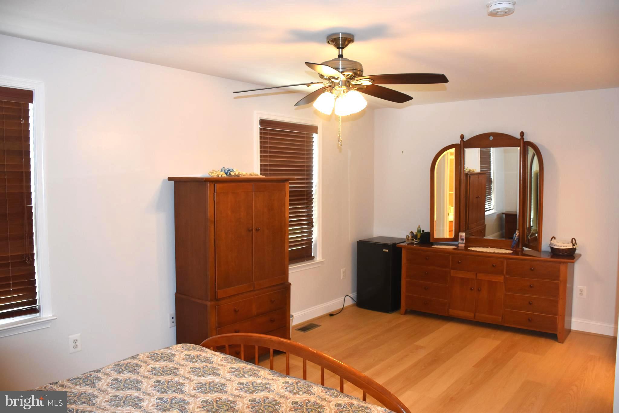 803 Ryan Street Baltimore, MD 21230 - Photo 21 of 41 a bedroom with a bed and dresser