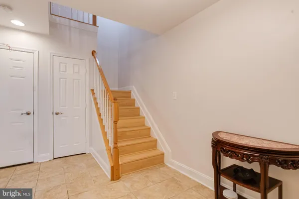 a dining room with a table and chairs