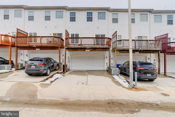 a view of a brick house with large windows