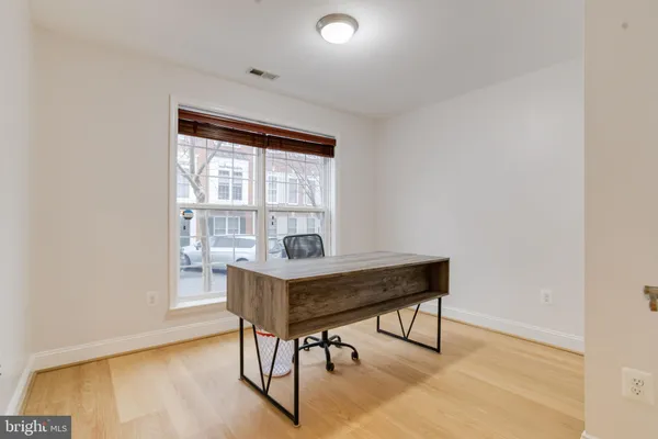 a bathroom with a shower a toilet and sink