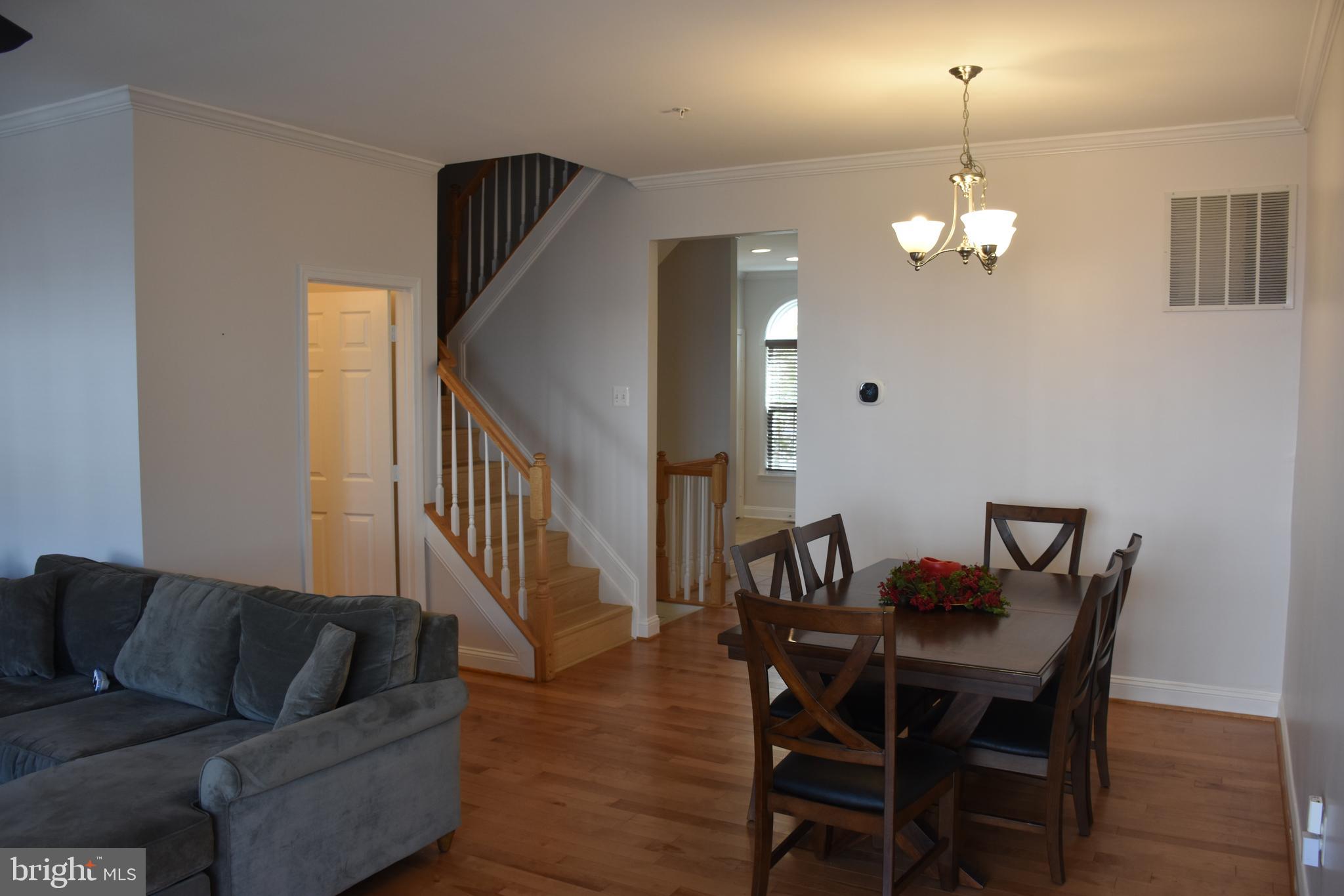 803 Ryan Street Baltimore, MD 21230 - Photo 10 of 41 a view of a dining room with furniture and wooden floor