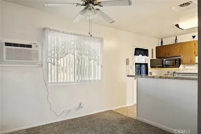 a kitchen with cabinets and window
