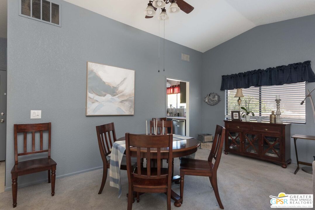 9760 Capiland Road Desert Hot Springs, CA 92240 - Photo 4 of 16 a view of a dining room with furniture