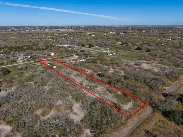 an aerial view of beach and ocean