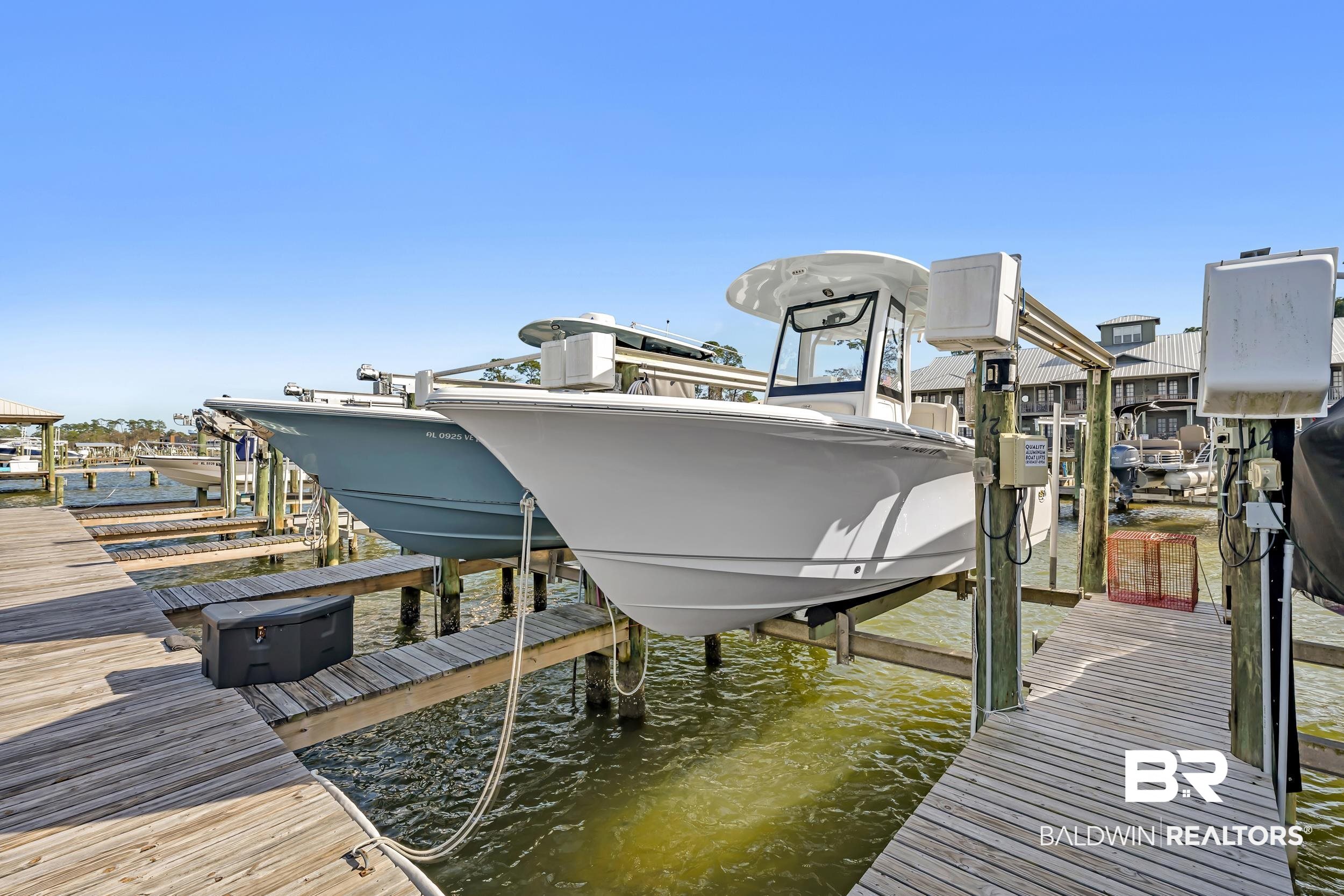 25773 Canal Road, Unit 32 Orange Beach, AL 36561 - Photo 30 of 35 Dock with boat lift and a water view