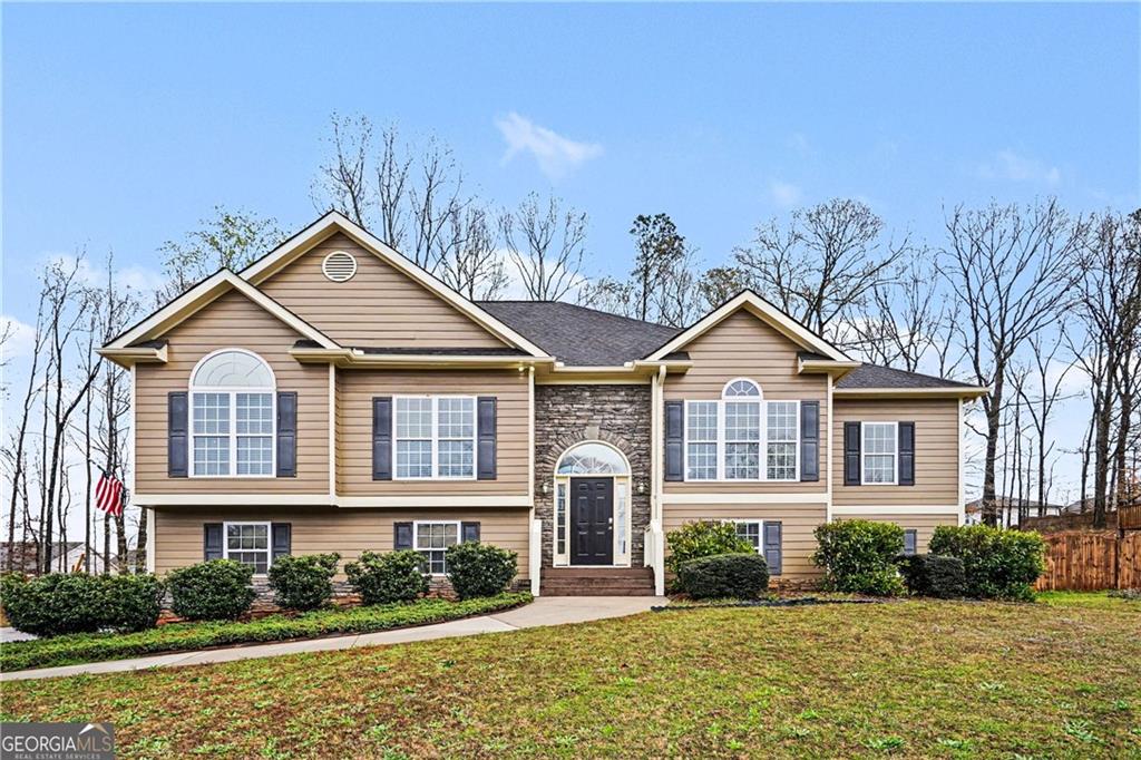 a front view of a house with a yard