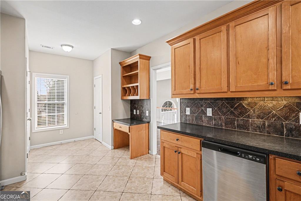 159 Sable Trace Trail Acworth, GA 30102 - Photo 13 of 40 a kitchen with stainless steel appliances granite countertop a stove a sink and a microwave
