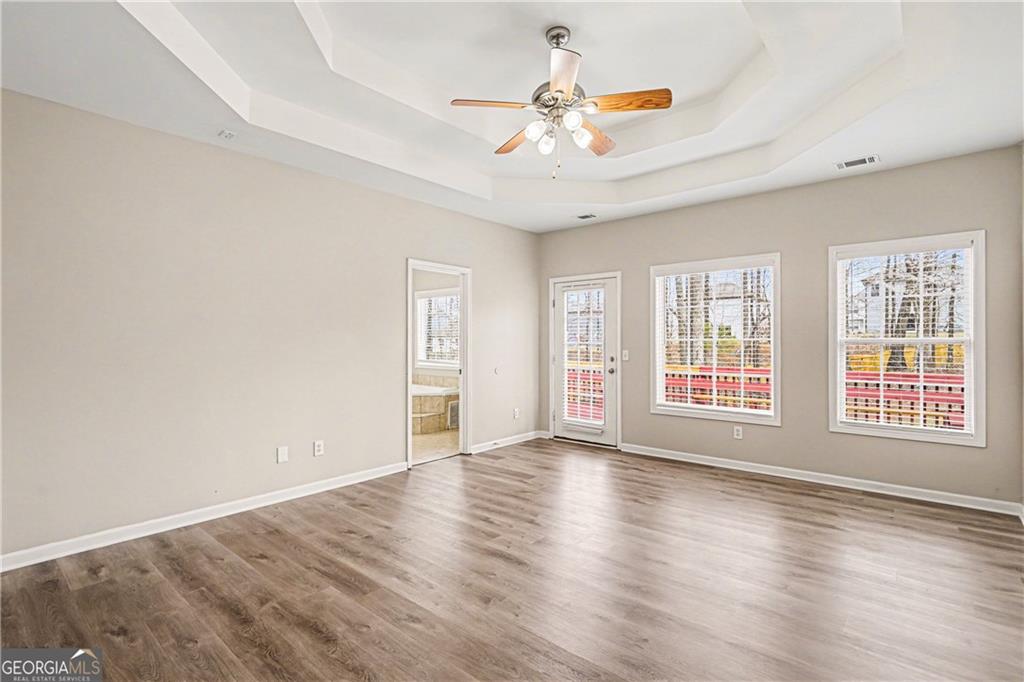 159 Sable Trace Trail Acworth, GA 30102 - Photo 14 of 40 a view of an empty room with a window and wooden floor