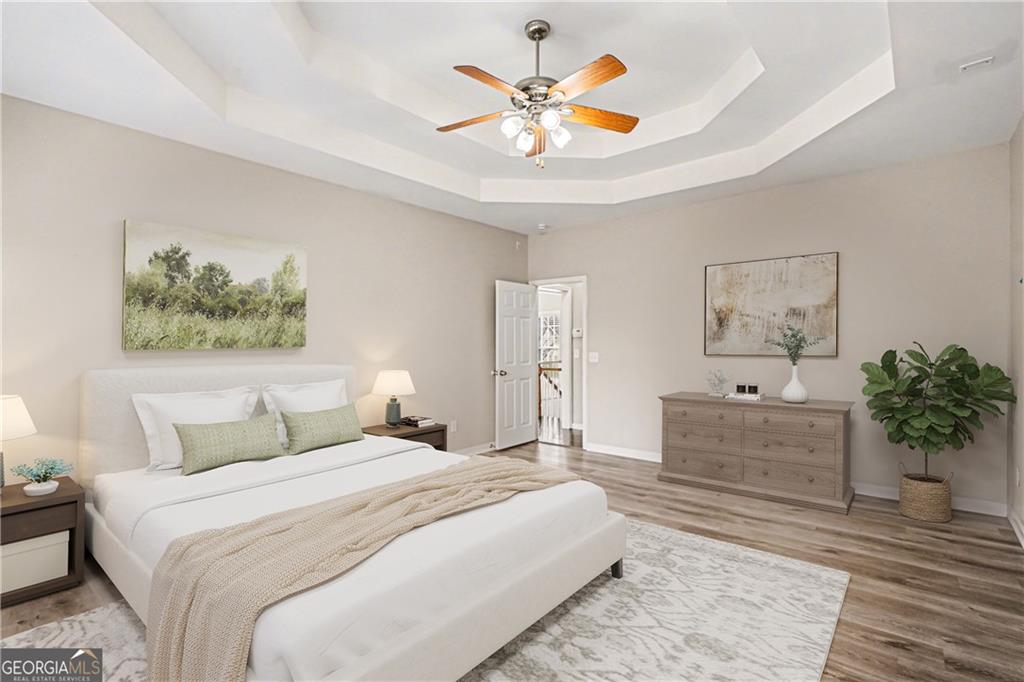 159 Sable Trace Trail Acworth, GA 30102 - Photo 15 of 40 a spacious bedroom with a bed and a painting on the wall