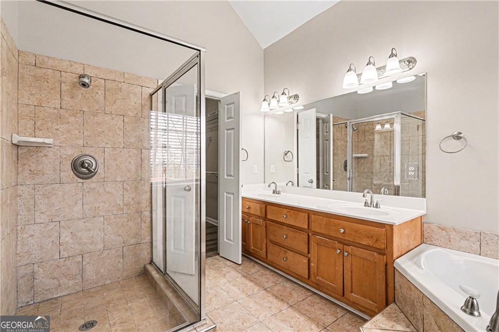 159 Sable Trace Trail Acworth, GA 30102 - Photo 19 of 40 a bathroom with a double vanity sink mirror and shower