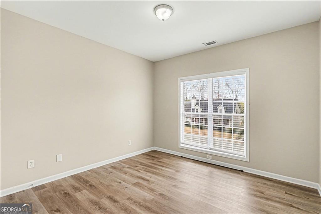 159 Sable Trace Trail Acworth, GA 30102 - Photo 21 of 40 an empty room with wooden floor and windows