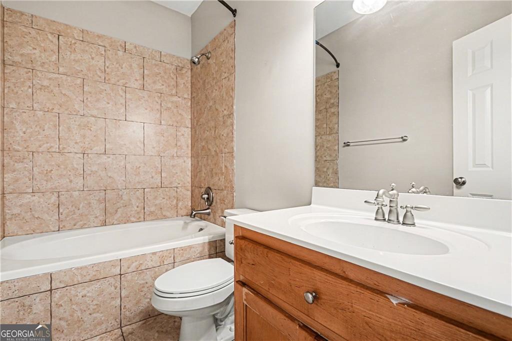 159 Sable Trace Trail Acworth, GA 30102 - Photo 22 of 40 a bathroom with a sink a toilet and bathtub