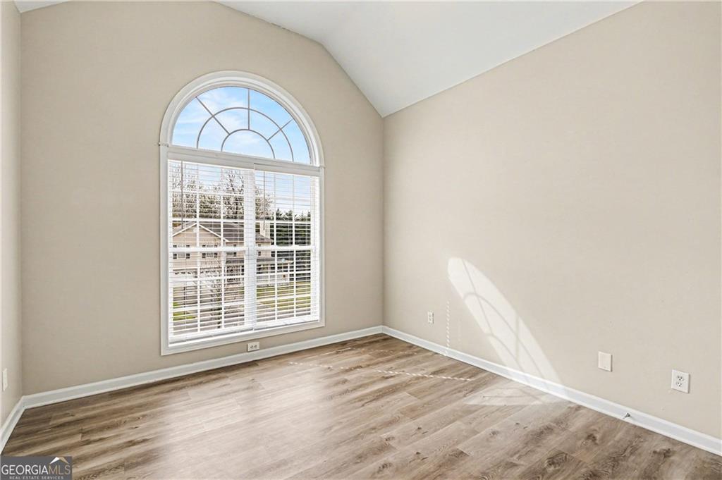 159 Sable Trace Trail Acworth, GA 30102 - Photo 23 of 40 an empty room with wooden floor cabinet and windows