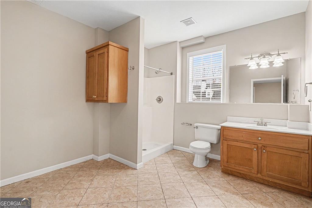 159 Sable Trace Trail Acworth, GA 30102 - Photo 28 of 40 a bathroom with a toilet sink and mirror