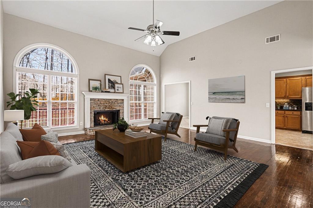159 Sable Trace Trail Acworth, GA 30102 - Photo 3 of 40 a living room with furniture a fireplace and a large window