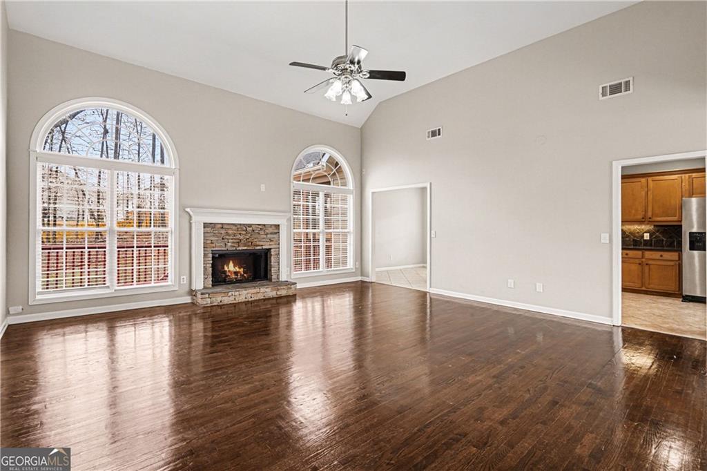 159 Sable Trace Trail Acworth, GA 30102 - Photo 4 of 40 a view of an empty room with wooden floor fireplace and a window