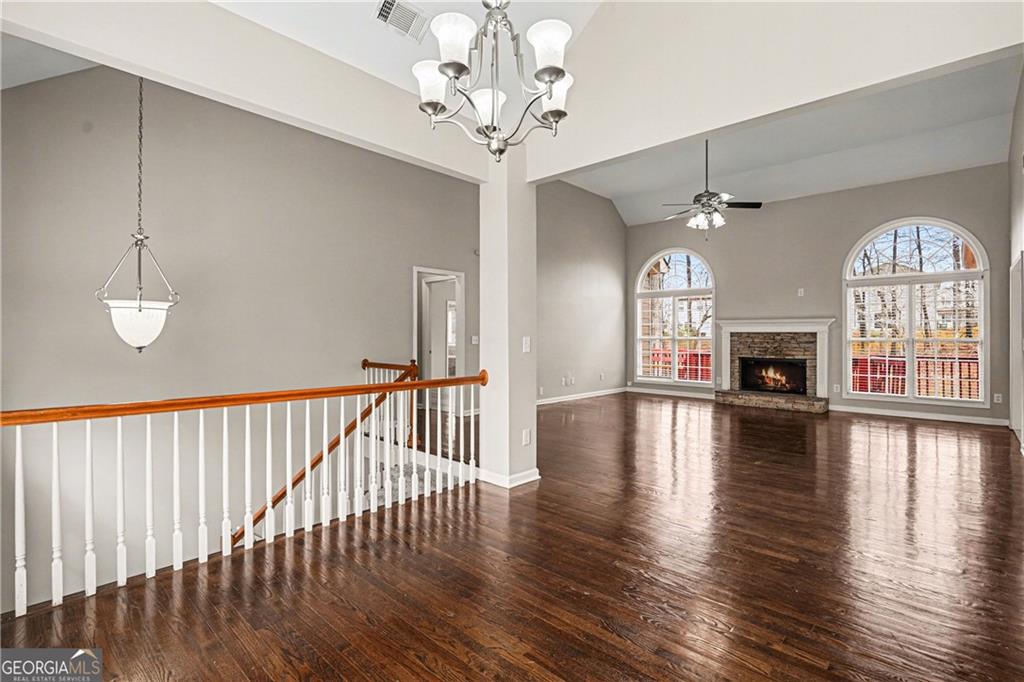 159 Sable Trace Trail Acworth, GA 30102 - Photo 7 of 40 a view of a livingroom with a fireplace wooden floor and chandelier