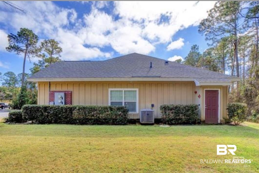 430 West Fort Morgan Road Gulf Shores, AL 36542 - Photo 27 of 27 Single-story residence featuring light-colored vertical siding and a dark shingle roof