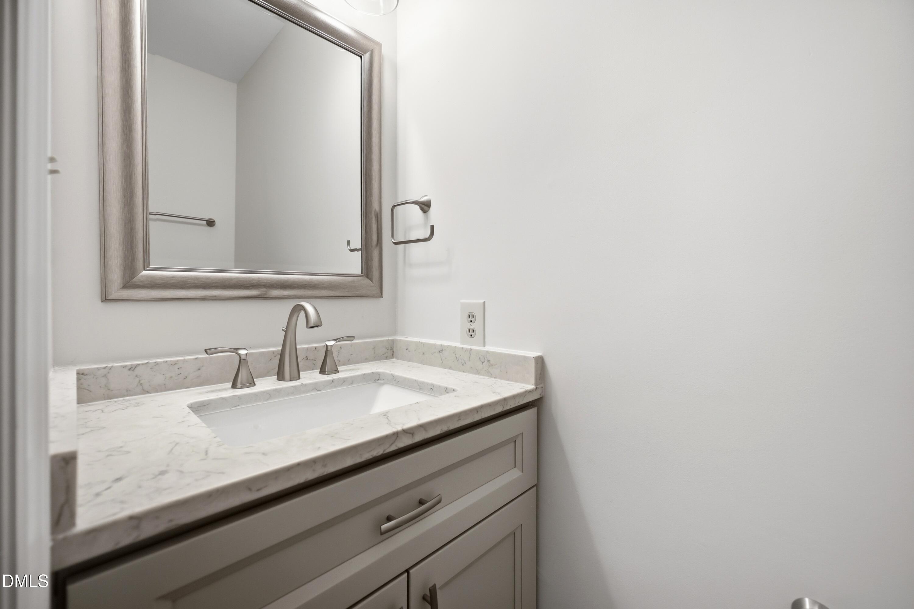 669 Bashford Road Raleigh, NC 27606 - Photo 13 of 19 a bathroom with a sink and a mirror