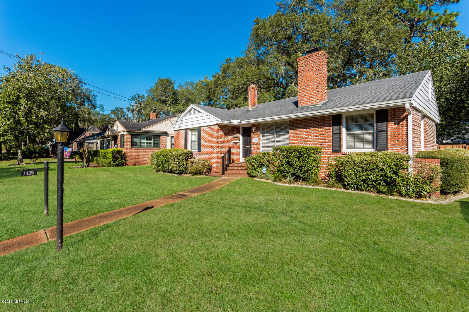 1435 Nicholson Road Jacksonville, FL 32207 - Photo 1 of 24 a front view of house with yard and green space
