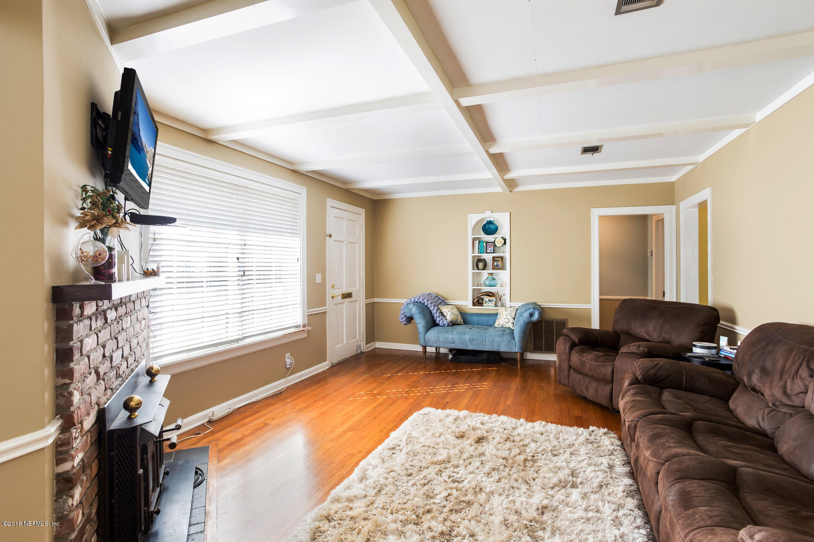 1435 Nicholson Road Jacksonville, FL 32207 - Photo 14 of 24 a living room with furniture and a flat screen tv