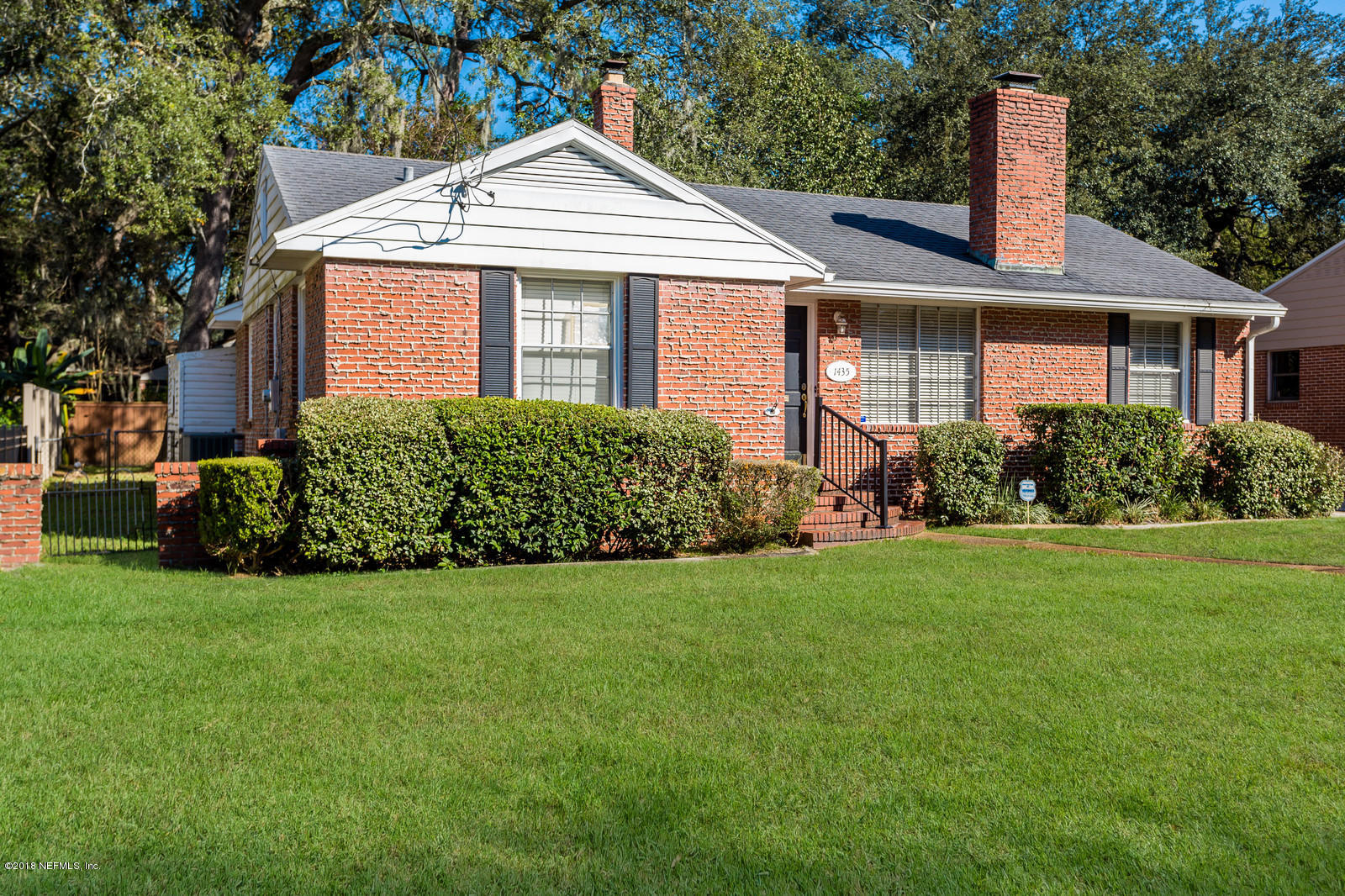 1435 Nicholson Road Jacksonville, FL 32207 - Photo 3 of 24 a front view of a house with a garden