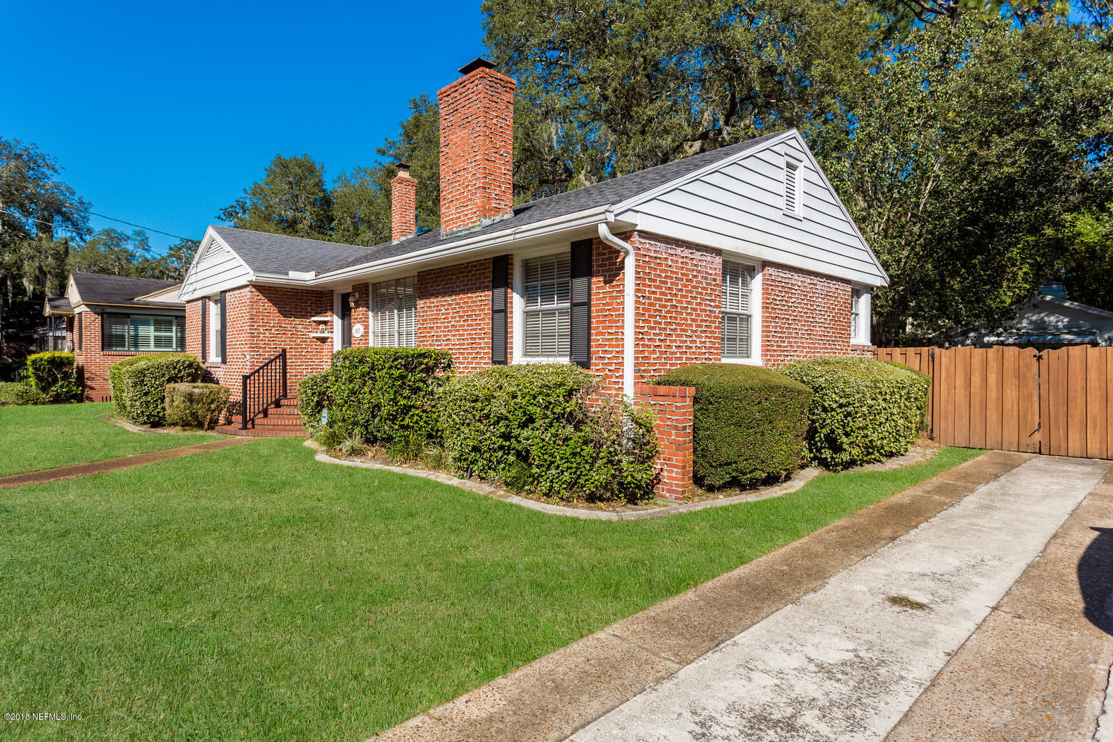 1435 Nicholson Road Jacksonville, FL 32207 - Photo 5 of 24 a front view of a house with a yard