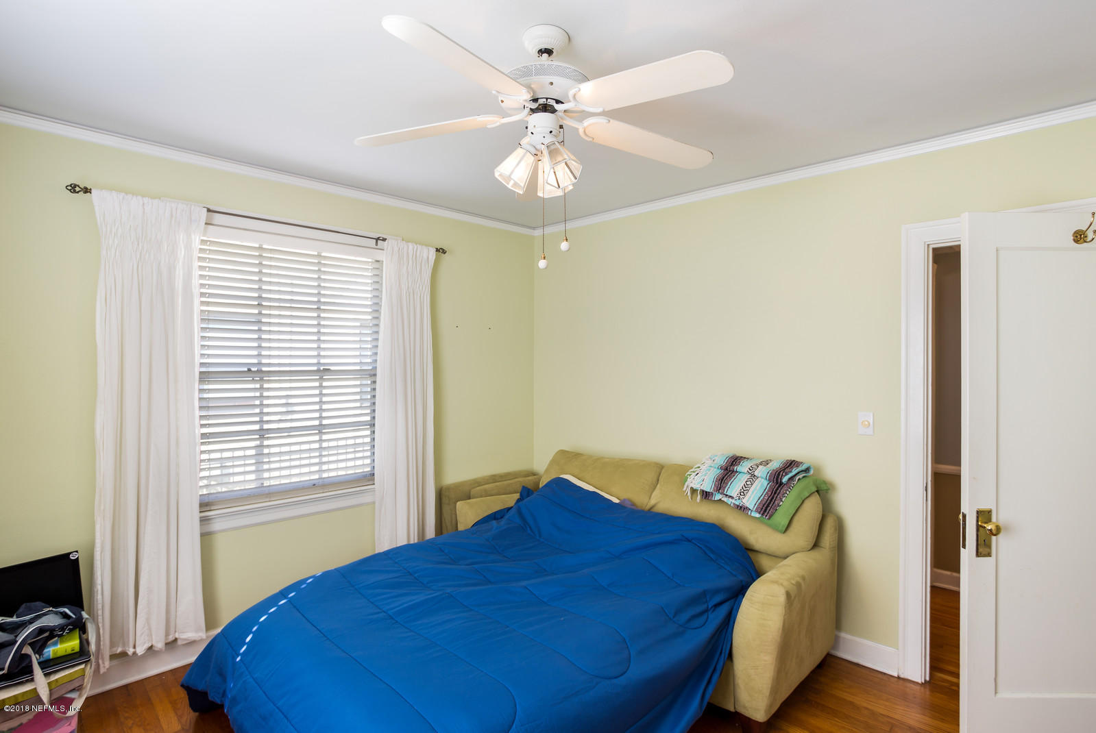 1435 Nicholson Road Jacksonville, FL 32207 - Photo 9 of 24 a bedroom with a bed and a window