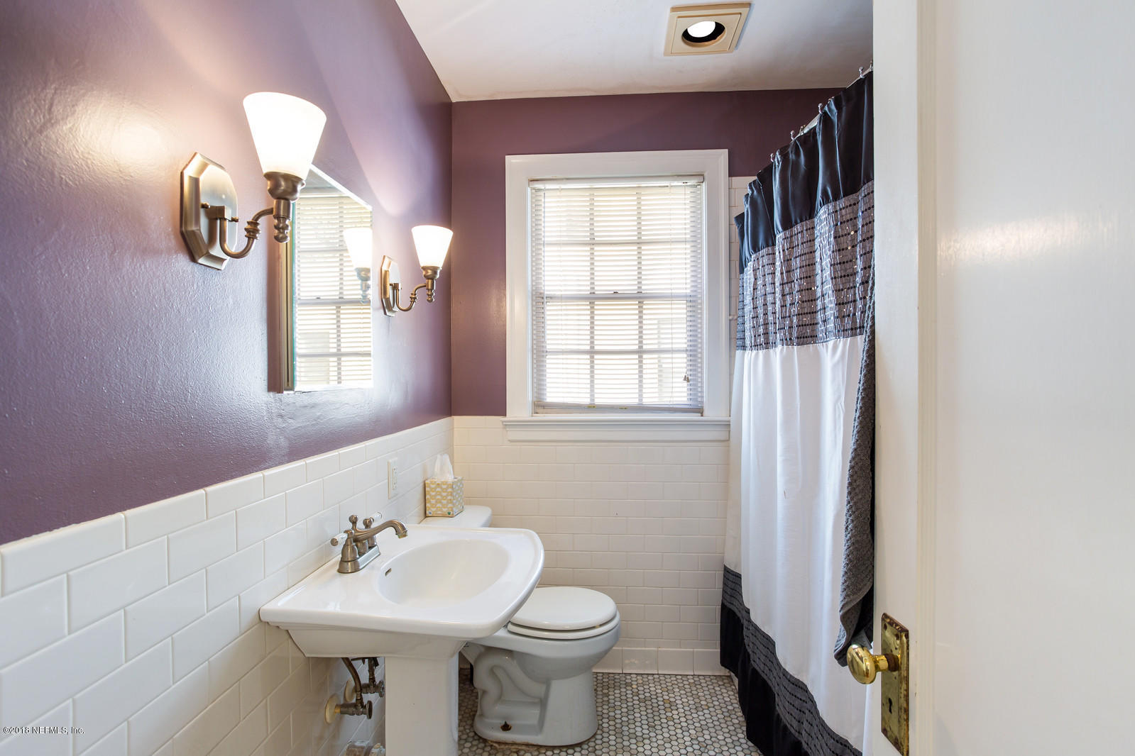 1435 Nicholson Road Jacksonville, FL 32207 - Photo 10 of 24 a bathroom with a sink toilet and a mirror