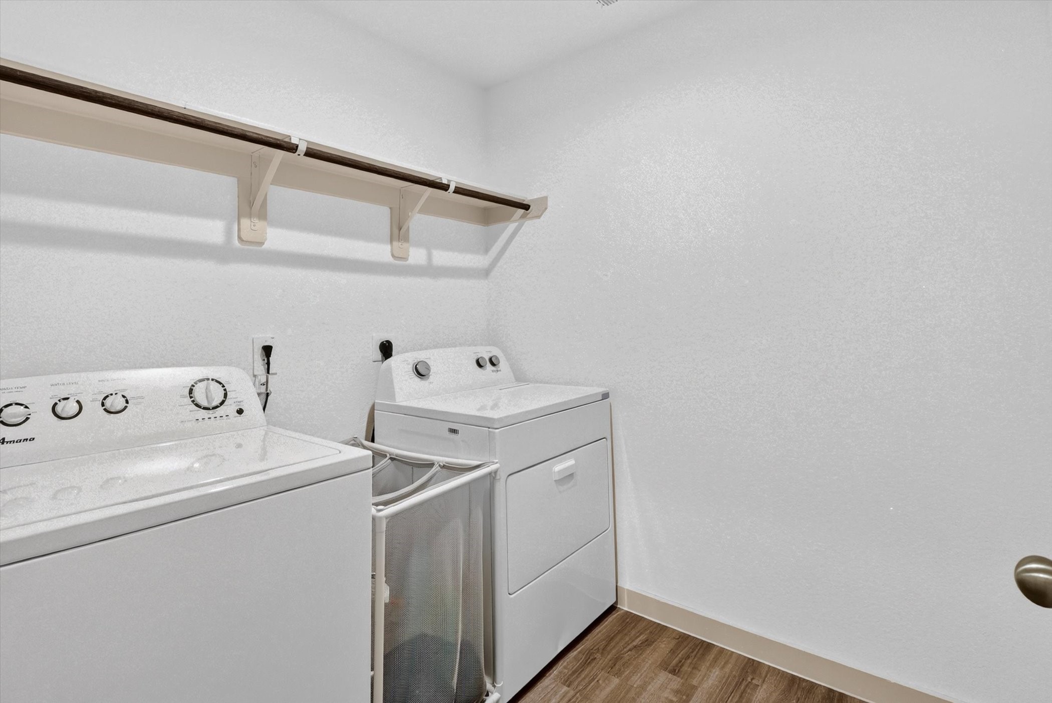 7907 Sleek Flock Lane Rosharon, TX 77583 - Photo 26 of 28 The dedicated laundry room sits near the garage and secondary bedrooms, with built-in shelving that adds useful storage right where you need it.