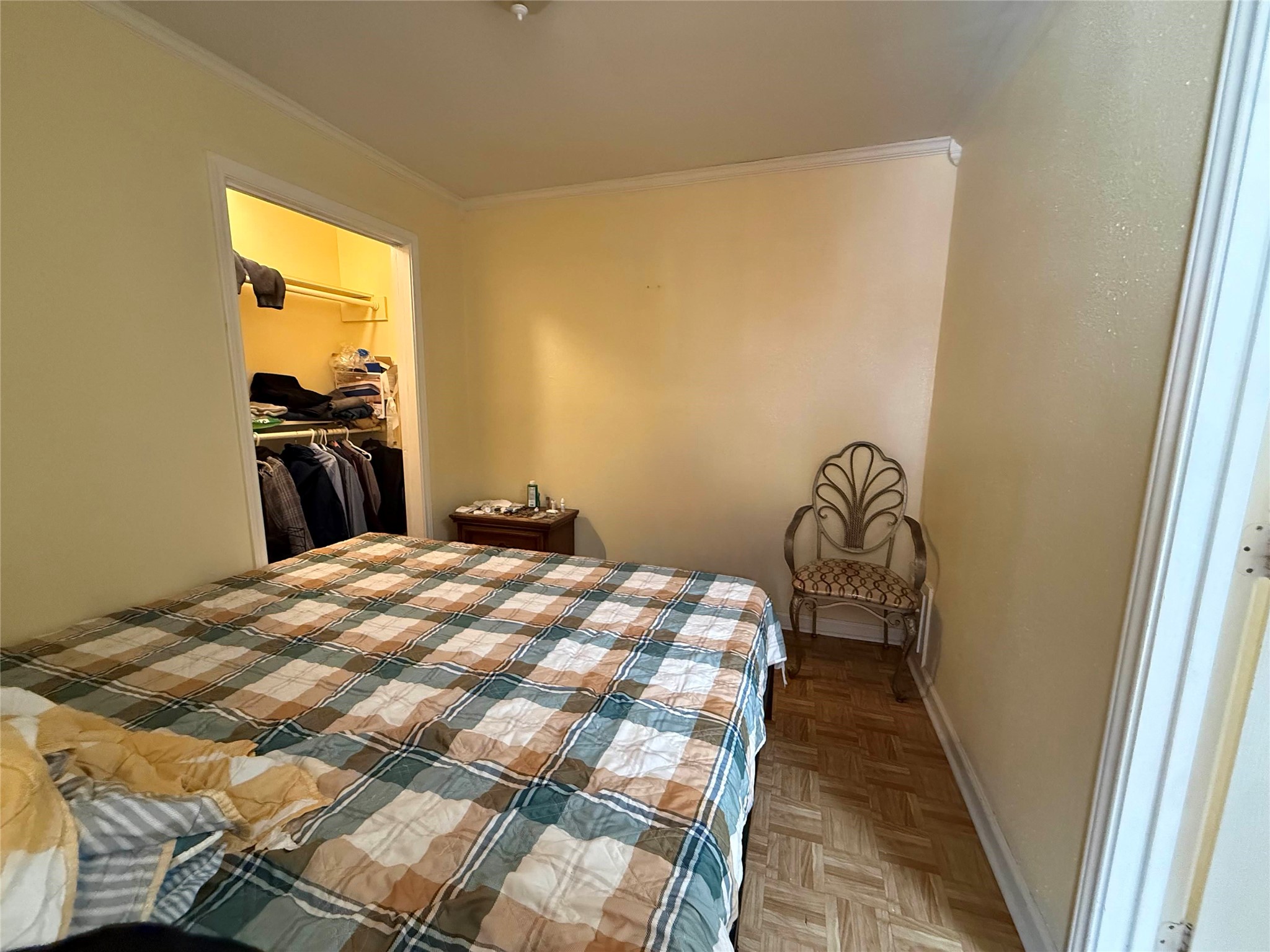 7047 Bissonnet Street, Unit 32 Houston, TX 77074 - Photo 13 of 19 a bedroom with a bed and a view of balcony