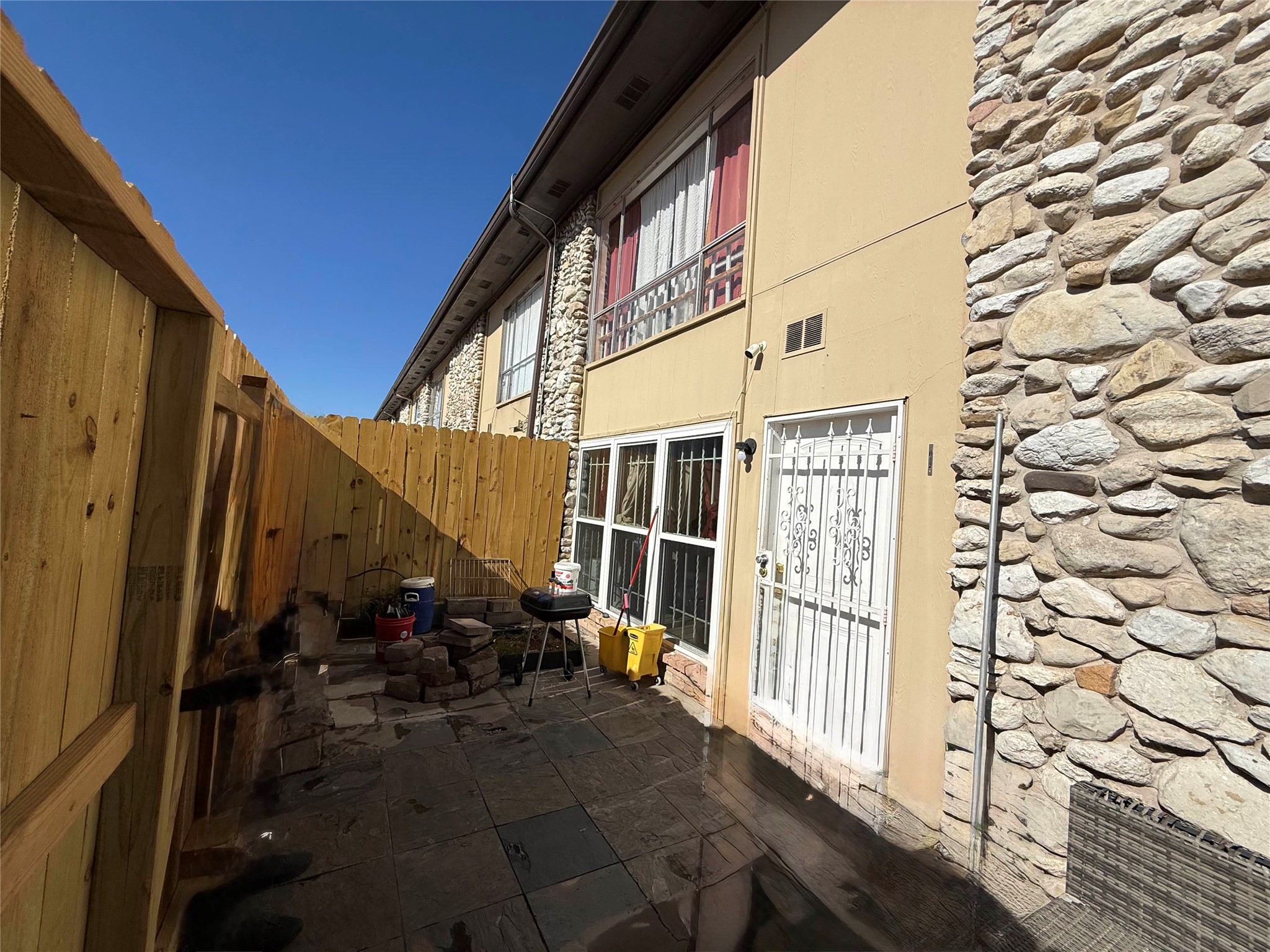 7047 Bissonnet Street, Unit 32 Houston, TX 77074 - Photo 18 of 19 a view of back yard of the house