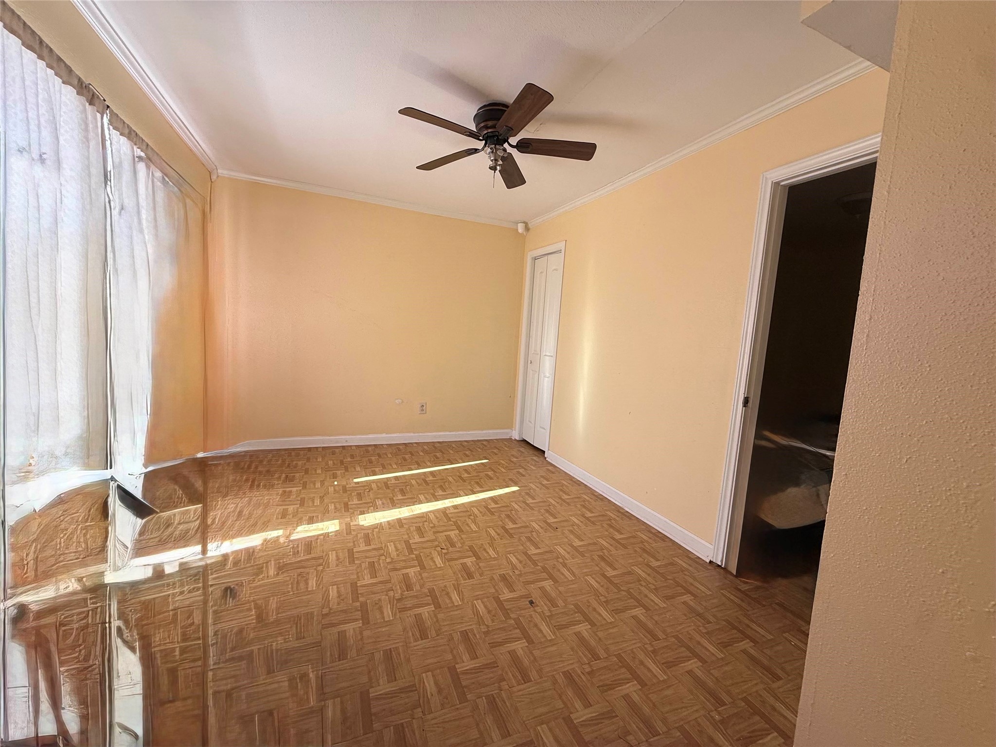 7047 Bissonnet Street, Unit 32 Houston, TX 77074 - Photo 7 of 19 a view of room with window and ceiling fan