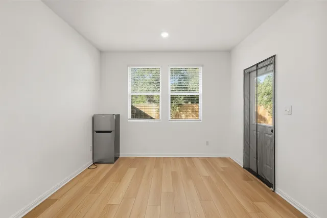 a kitchen with stainless steel appliances granite countertop a sink a stove and a refrigerator