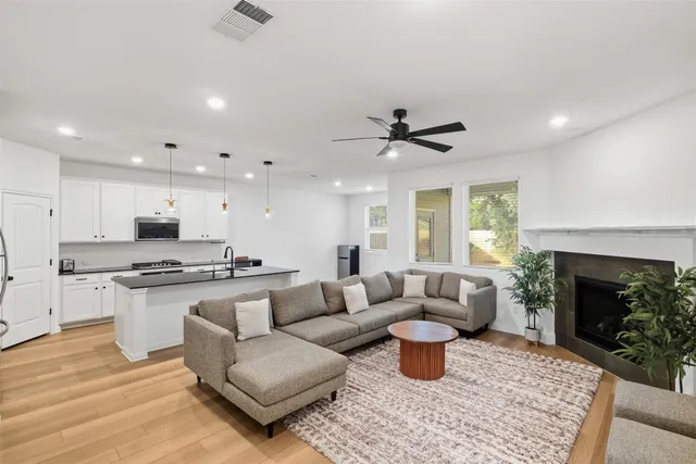 a living room with furniture and a fireplace