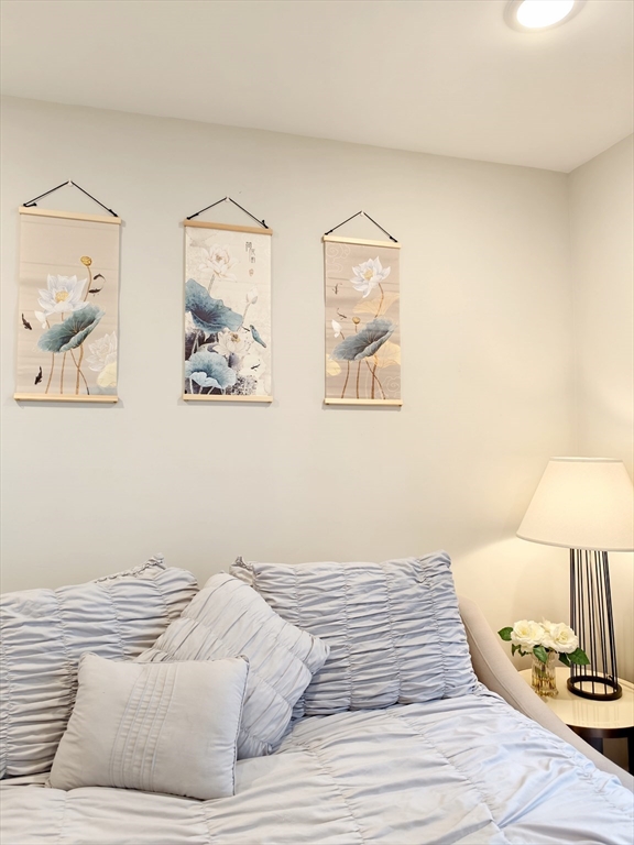 58 Dustin Street, Unit 1 Boston, MA 02135 - Photo 15 of 29 a bedroom with a bed and a painting on the wall