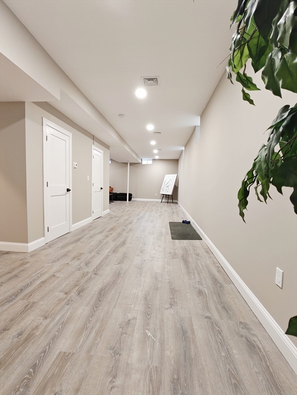 58 Dustin Street, Unit 1 Boston, MA 02135 - Photo 21 of 29 a view of a room with wooden floor