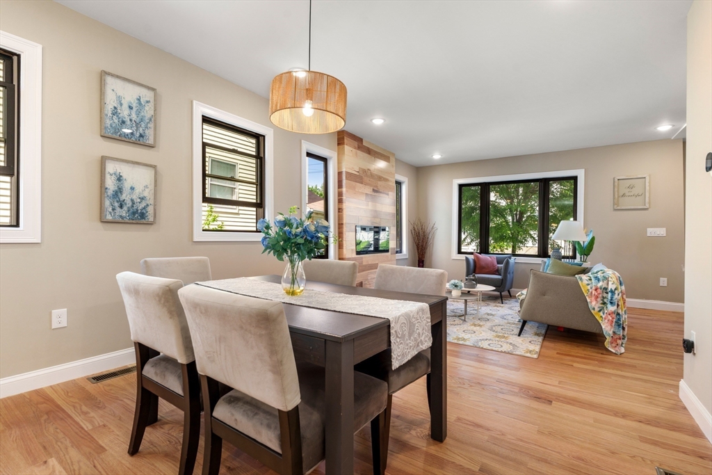 58 Dustin Street, Unit 1 Boston, MA 02135 - Photo 4 of 29 a view of a dining room with furniture window and wooden floor