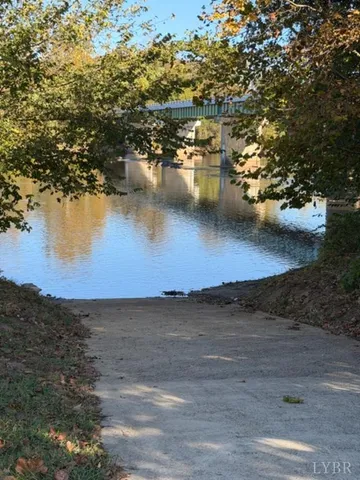 a view of a lake with houses in background