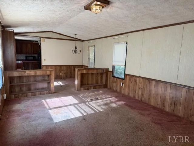 a view of a hallway with seating area