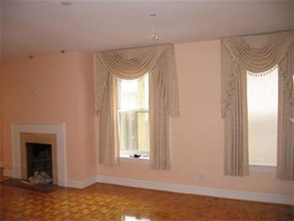 416 Commonwealth Avenue, Unit 507 Boston, MA 02215 - Photo 3 of 5 a view of a small space with wooden floor and a window