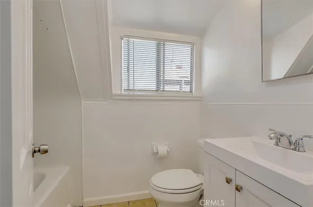 a bathroom with a sink toilet and vanity